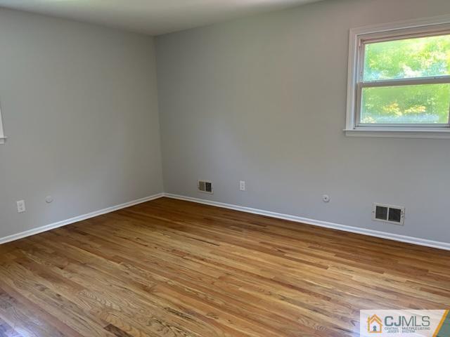 39 Bristol Road Piscataway, NJ 08854 - Photo 13 of 18 a view of empty room with wooden floor