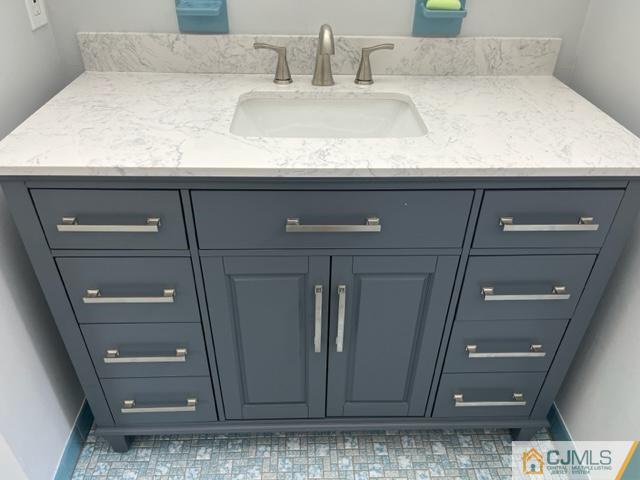 39 Bristol Road Piscataway, NJ 08854 - Photo 16 of 18 a bathroom with a sink and mirror