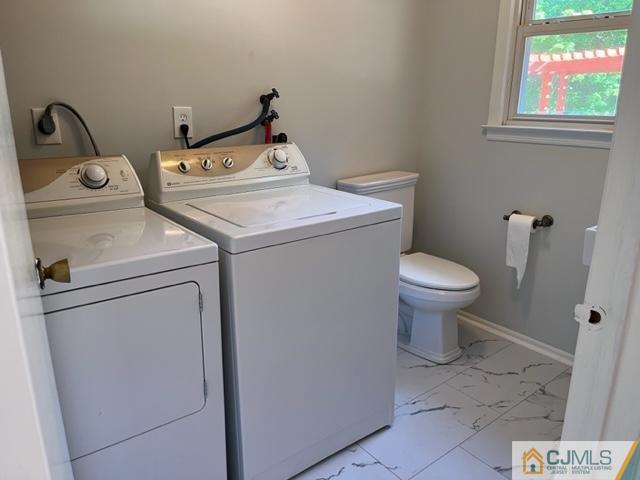 39 Bristol Road Piscataway, NJ 08854 - Photo 17 of 18 a utility room with dryer and washer