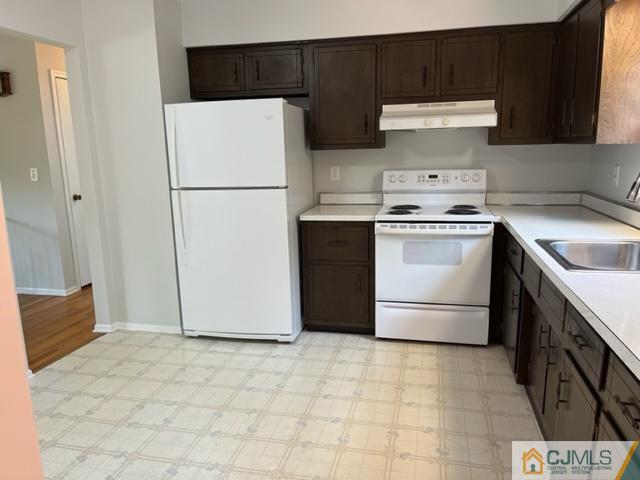 39 Bristol Road Piscataway, NJ 08854 - Photo 8 of 18 a kitchen with a stove a refrigerator and a sink