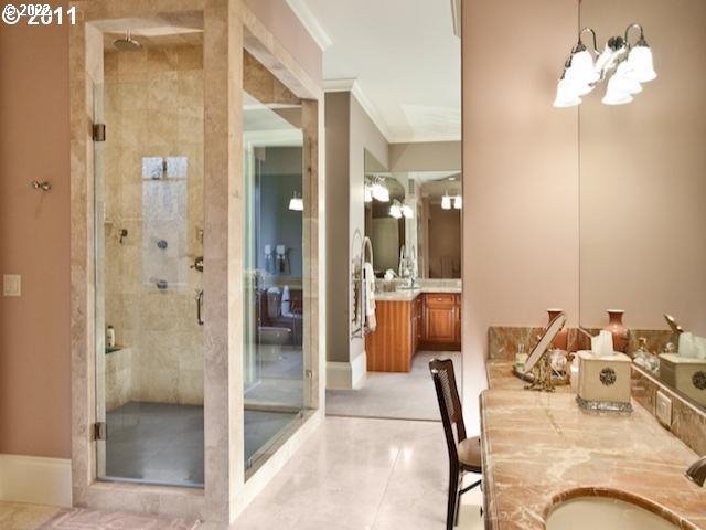 1186 Crestline Court Lake Oswego, OR 97034 - Photo 12 of 21 a bathroom with a granite countertop sink a mirror and shower