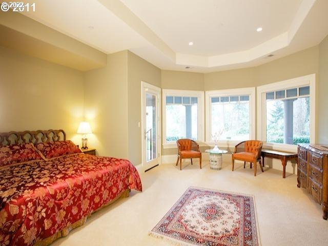 1186 Crestline Court Lake Oswego, OR 97034 - Photo 14 of 21 a bedroom with a bed and large windows