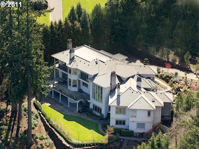 1186 Crestline Court Lake Oswego, OR 97034 - Photo 3 of 21 an aerial view of a house with a big yard and large trees