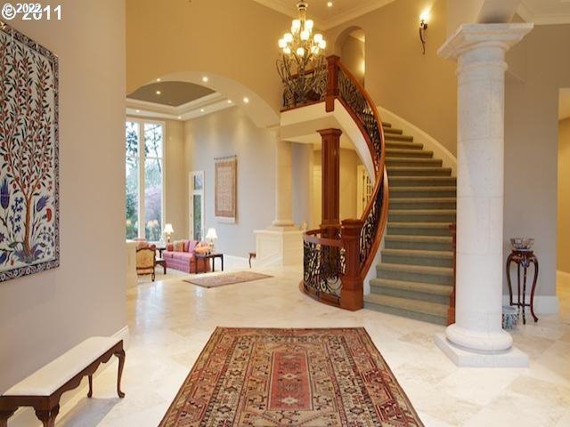 1186 Crestline Court Lake Oswego, OR 97034 - Photo 5 of 21 a view of a hallway with a couch and chandelier