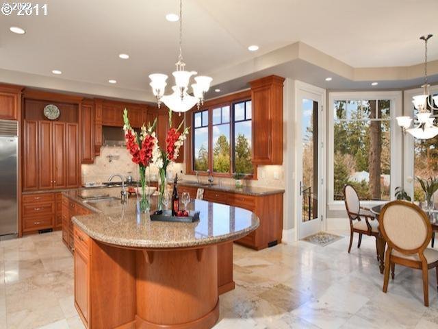 1186 Crestline Court Lake Oswego, OR 97034 - Photo 8 of 21 a dining table with chairs and chandelier