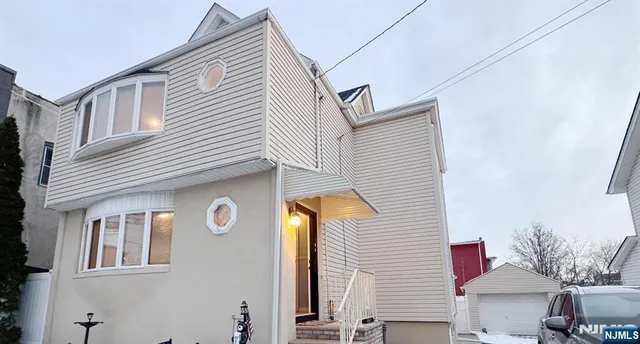 a front view of a house with yard