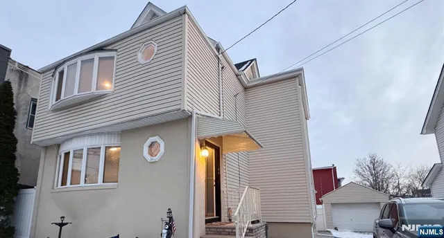 a front view of a house with yard