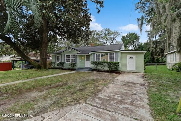 1752 Lilly Road East Jacksonville, FL 32207 - Photo 2 of 31 a front view of a house with a garden