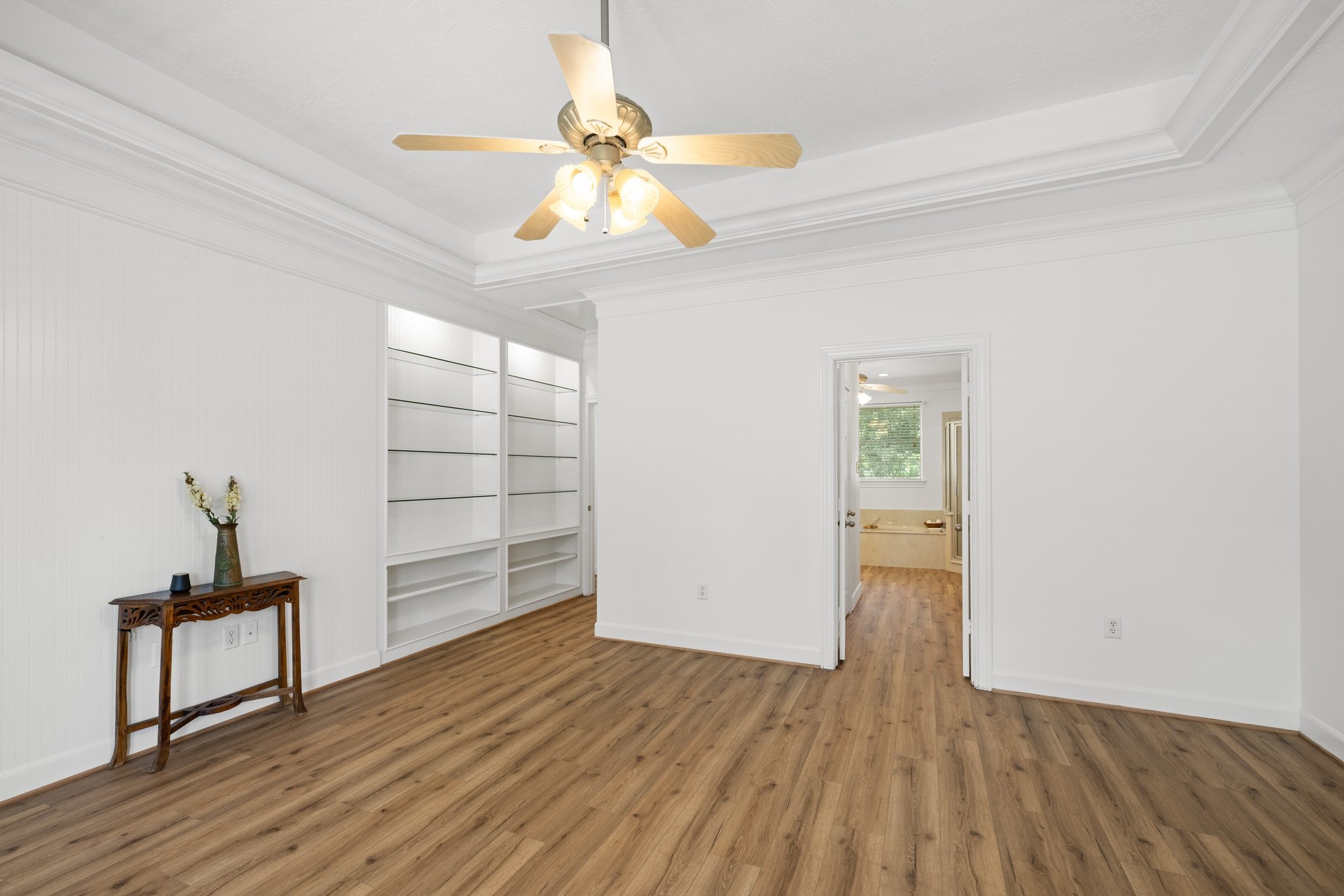 34310 High Point Drive Magnolia, TX 77355 - Photo 15 of 48 Explore the elegant built-in shelves in the primary bedroom, perfect for showcasing your art and cherished photos.
