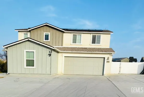 a front view of a house with a garage