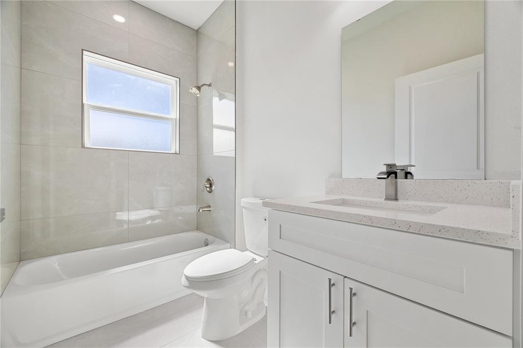 16281 Southwest 48th Circle Ocala, FL 34473 - Photo 12 of 26 a bathroom with a sink a toilet and shower