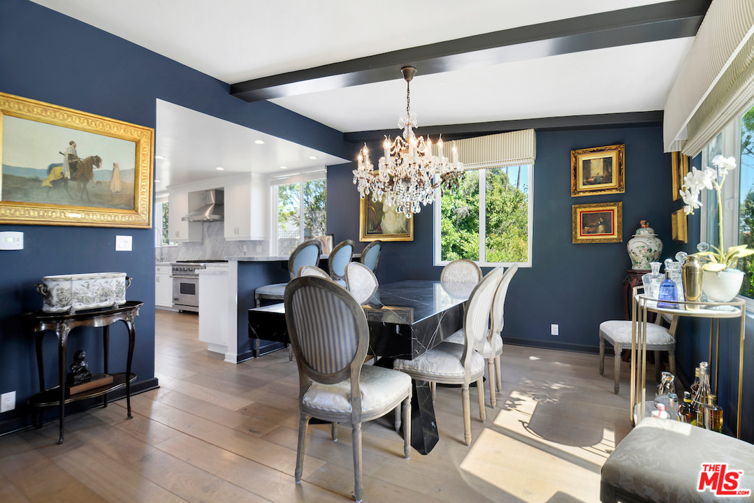 1077 Stradella Road Los Angeles, CA 90077 - Photo 8 of 25 a view of a dining room with furniture window and wooden floor