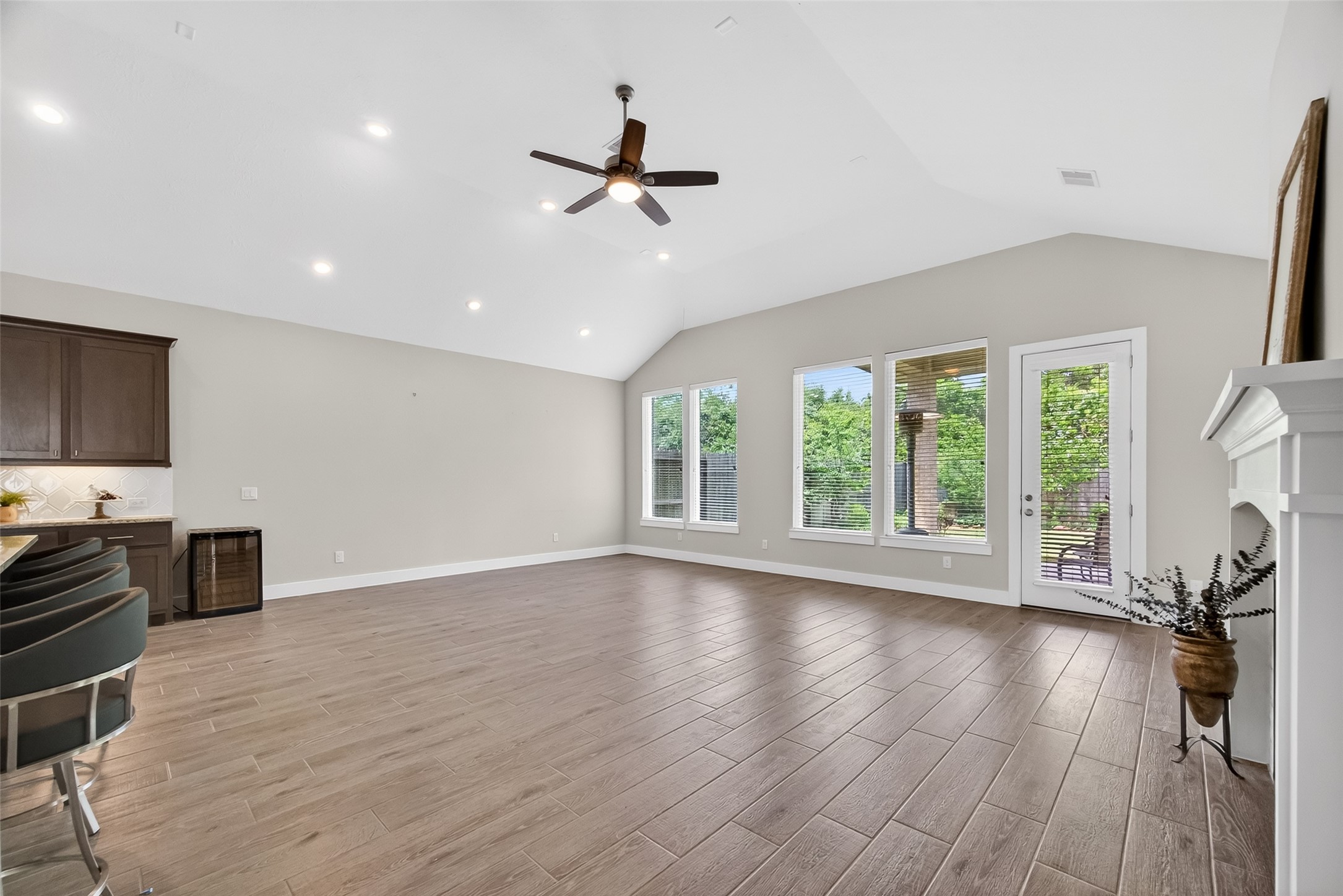 3415 Mckinney Ridge Drive Houston, TX 77059 - Photo 12 of 43 a view of an empty room with a window and wooden floor