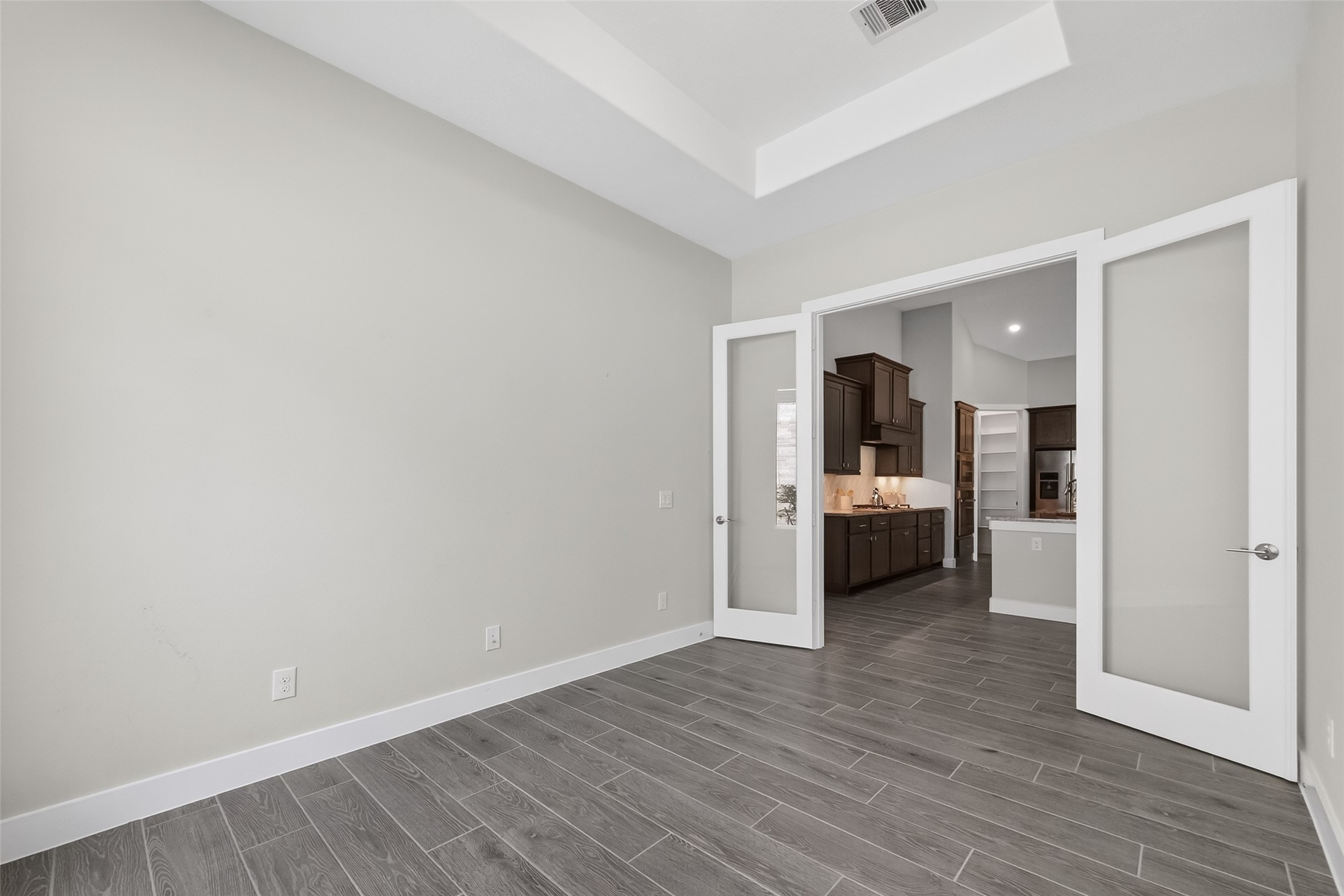 3415 Mckinney Ridge Drive Houston, TX 77059 - Photo 15 of 43 Double glass doors and tray ceiling enhance this spacious room.