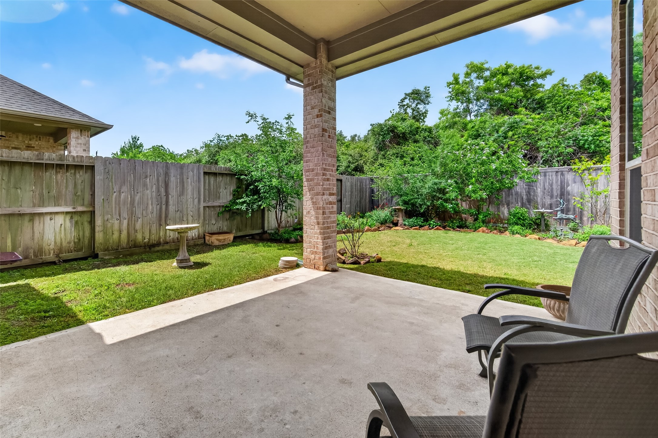 3415 Mckinney Ridge Drive Houston, TX 77059 - Photo 2 of 43 Great covered backyard patio with two chairs, perfect for watching the birds and relaxation.