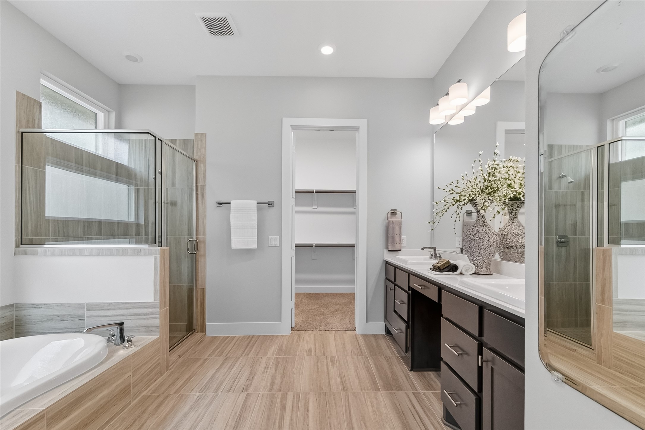 3415 Mckinney Ridge Drive Houston, TX 77059 - Photo 27 of 43 a view of bathroom with a sink mirror and shower