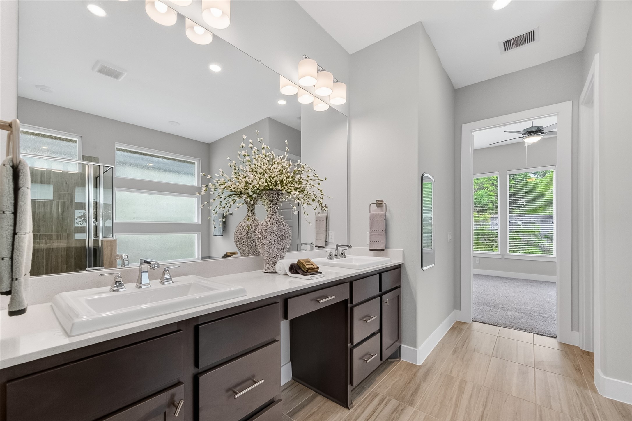 3415 Mckinney Ridge Drive Houston, TX 77059 - Photo 30 of 43 a bathroom with a sink double vanity and a mirror