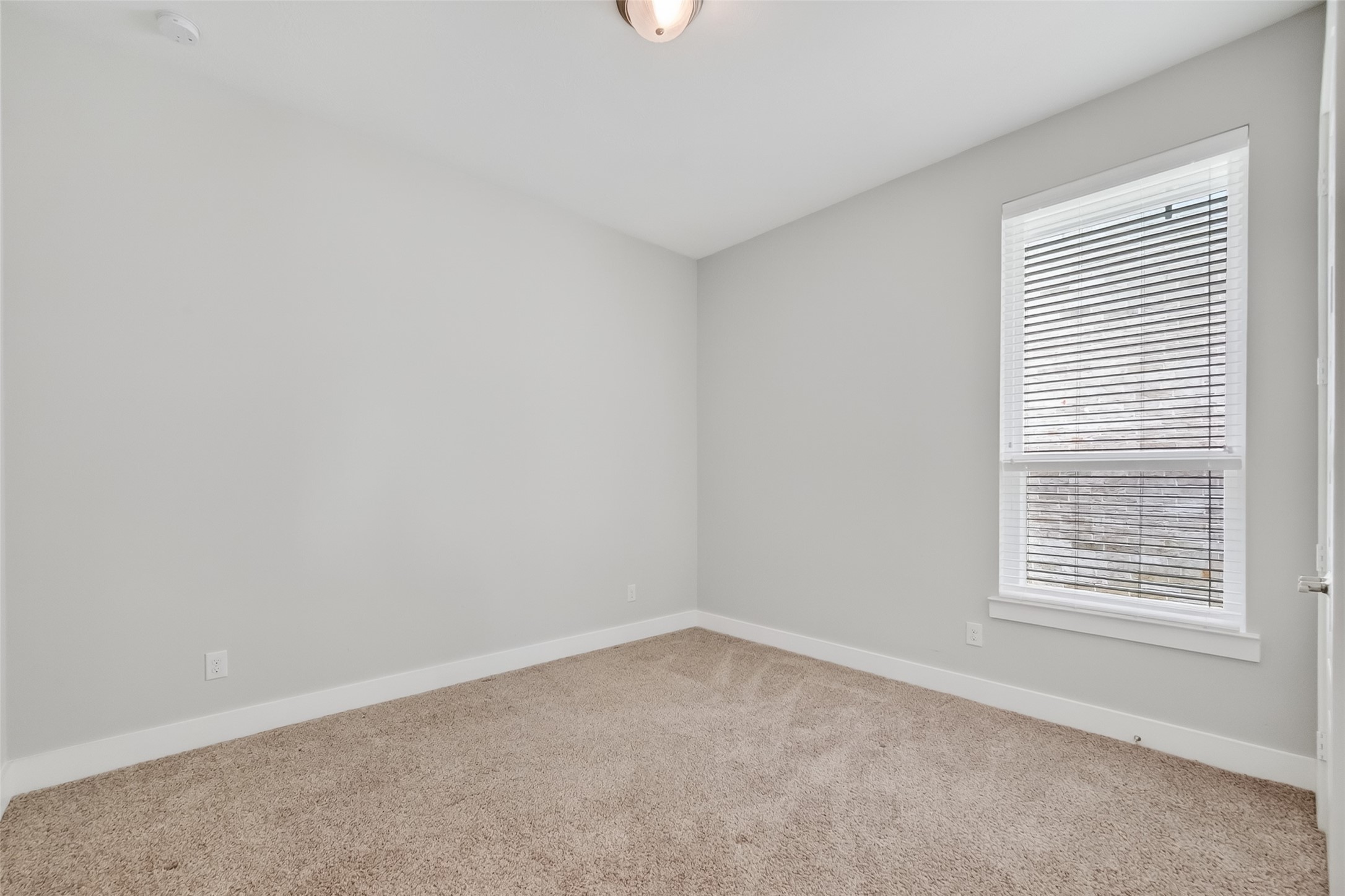 3415 Mckinney Ridge Drive Houston, TX 77059 - Photo 34 of 43 an empty room with a window