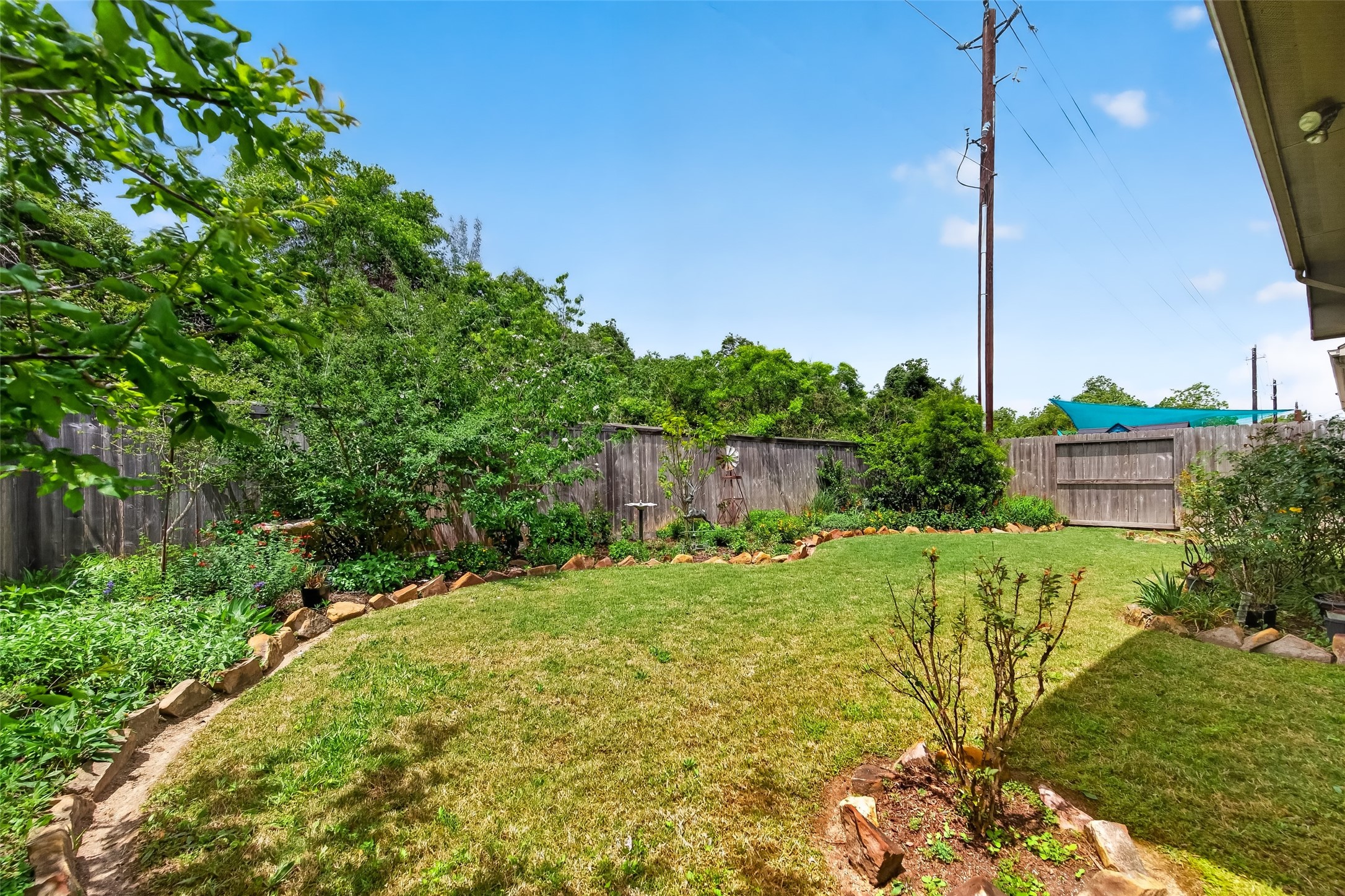 3415 Mckinney Ridge Drive Houston, TX 77059 - Photo 42 of 43 a view of a garden with a house in the background