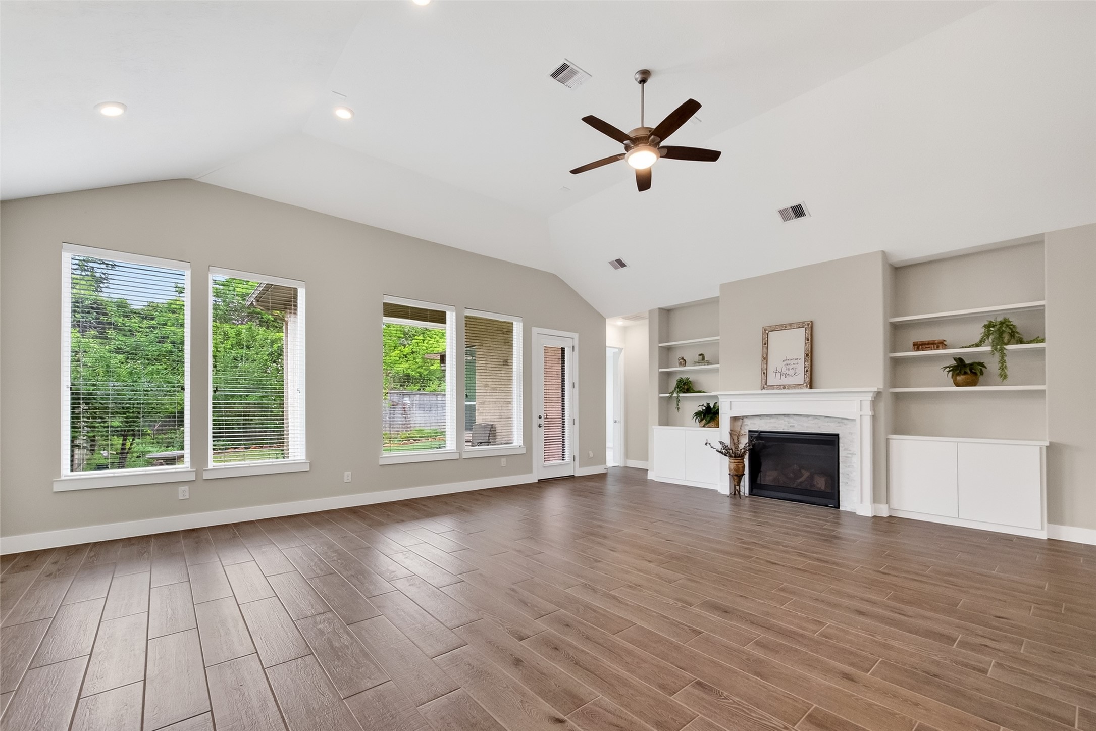 3415 Mckinney Ridge Drive Houston, TX 77059 - Photo 10 of 43 a view of an empty room with wooden floor and a window