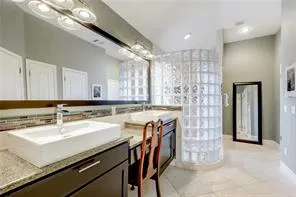 a kitchen with a sink and a refrigerator