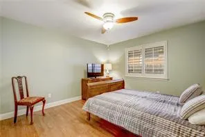 a bedroom with a bed and a chair