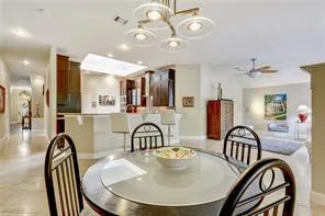 a view of a dining room and hall with furniture