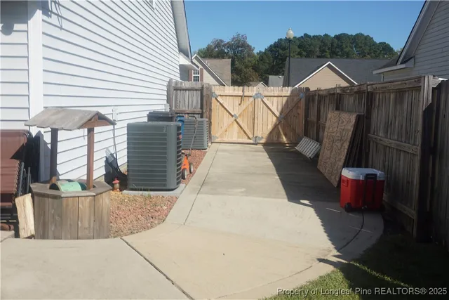 a view of a backyard with sitting area