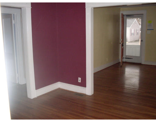 27 Eloise Street Springfield, MA 01118 - Photo 3 of 9 a view of an empty room with wooden floor and a window