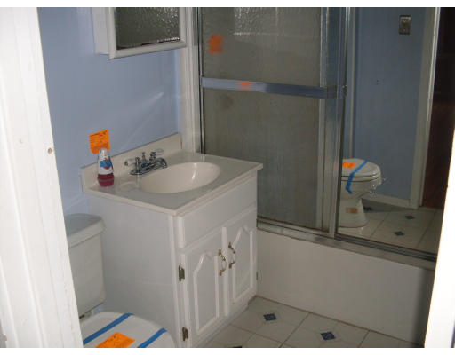 27 Eloise Street Springfield, MA 01118 - Photo 6 of 9 a bathroom with a sink and a mirror