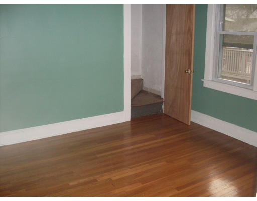 27 Eloise Street Springfield, MA 01118 - Photo 7 of 9 a view of a room with wooden floor and windows