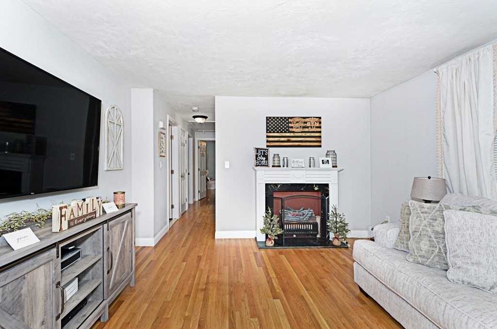 1 Hapgood Road Worcester, MA 01605 - Photo 14 of 34 a living room with furniture and a flat screen tv
