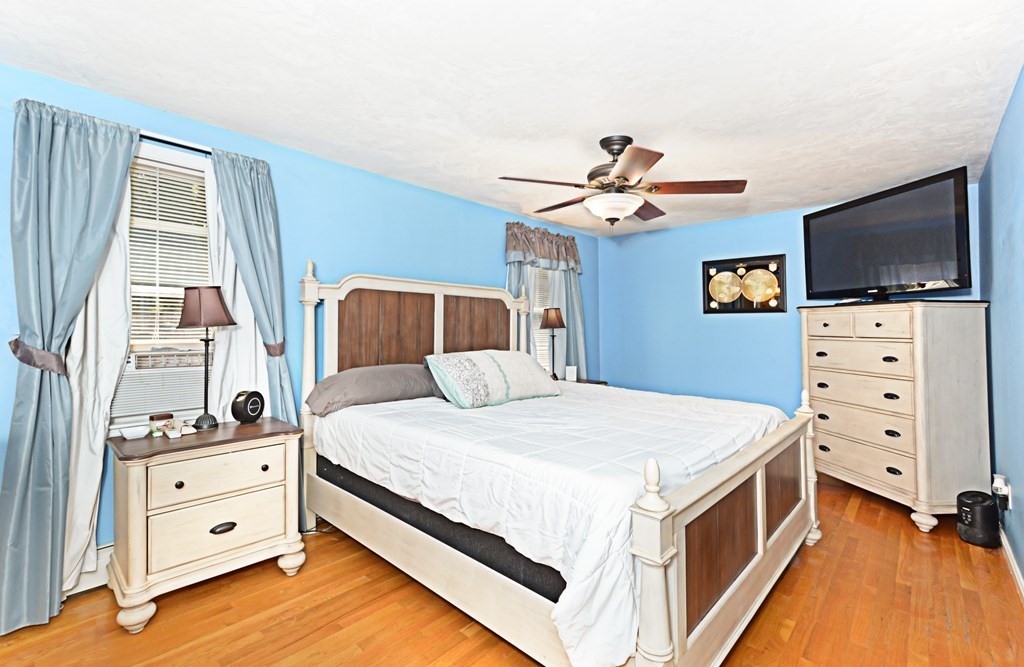 1 Hapgood Road Worcester, MA 01605 - Photo 19 of 34 a bedroom with a bed and a flat screen tv