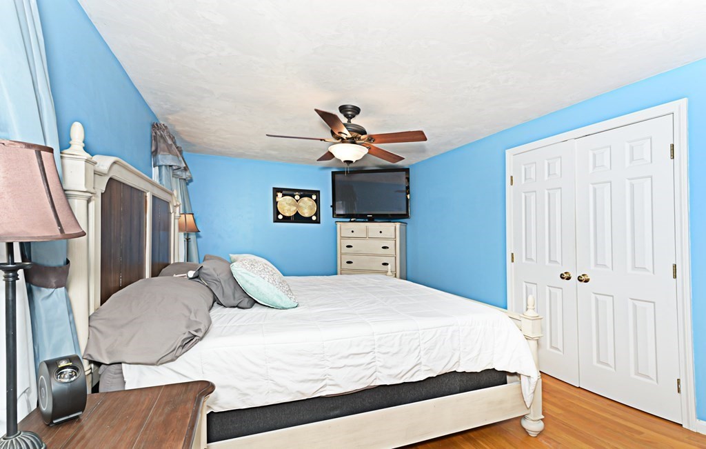 1 Hapgood Road Worcester, MA 01605 - Photo 20 of 34 a bedroom with a bed and dresser with wooden floor