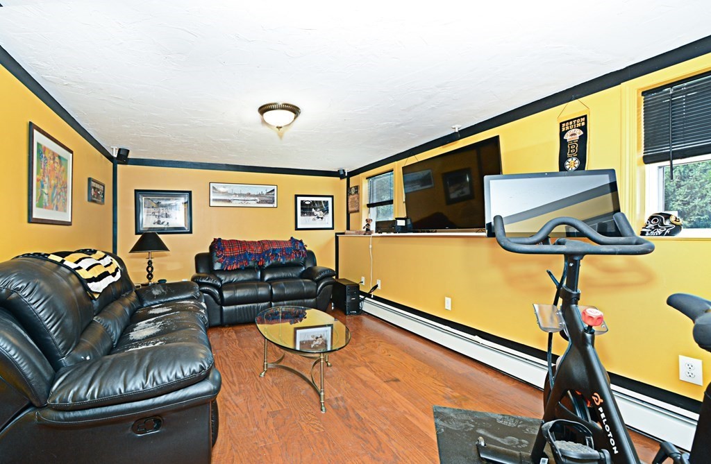 1 Hapgood Road Worcester, MA 01605 - Photo 25 of 34 a living room with furniture and a flat screen tv