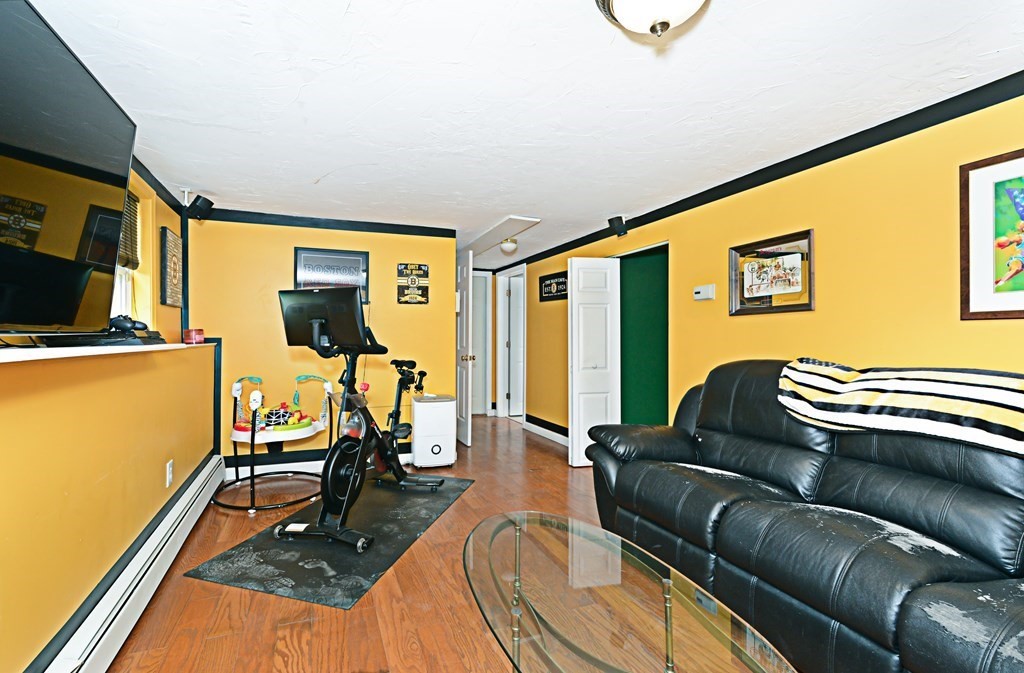 1 Hapgood Road Worcester, MA 01605 - Photo 26 of 34 a livingroom with furniture and a flat screen tv