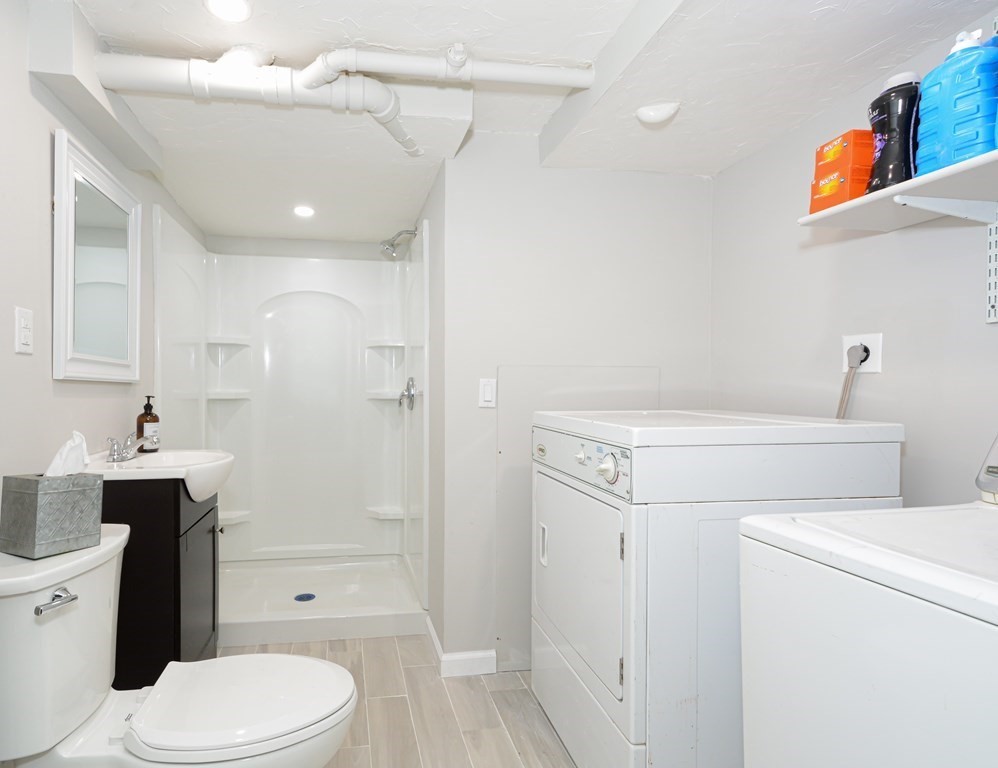 1 Hapgood Road Worcester, MA 01605 - Photo 28 of 34 a bathroom with a toilet sink vanity and shower