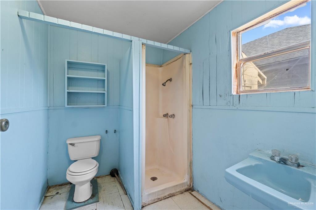 706 Doherty Avenue Mission, TX 78572 - Photo 15 of 21 a bathroom with a toilet sink and shower