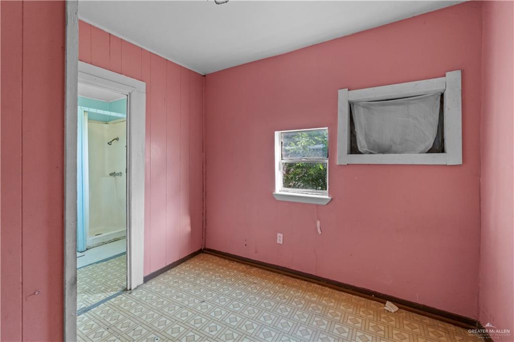 706 Doherty Avenue Mission, TX 78572 - Photo 9 of 21 a view of an empty room with a window
