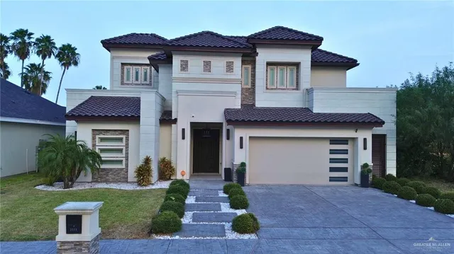 a front view of a house with garden