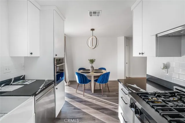 a kitchen with a stove and a microwave