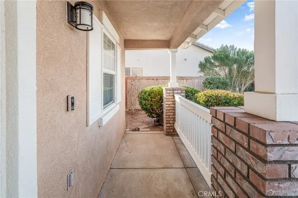 a bathroom with a granite countertop shower and a mirror