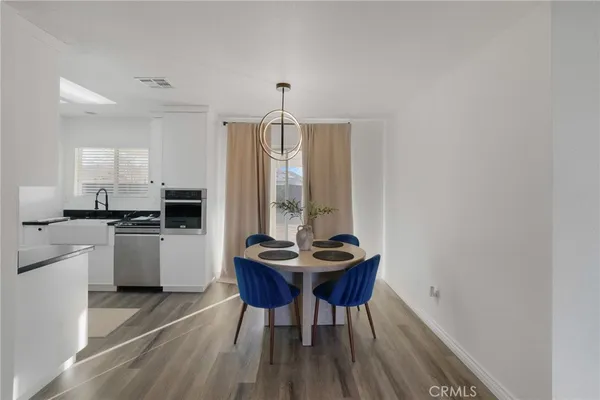 a kitchen with a table and chairs in it