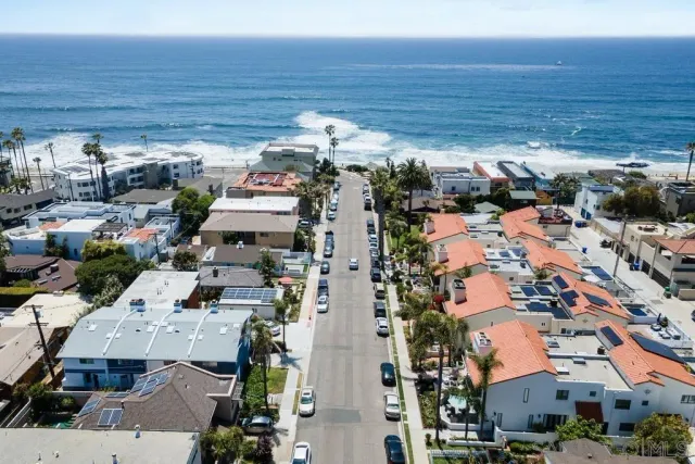 a view of a city with palm trees