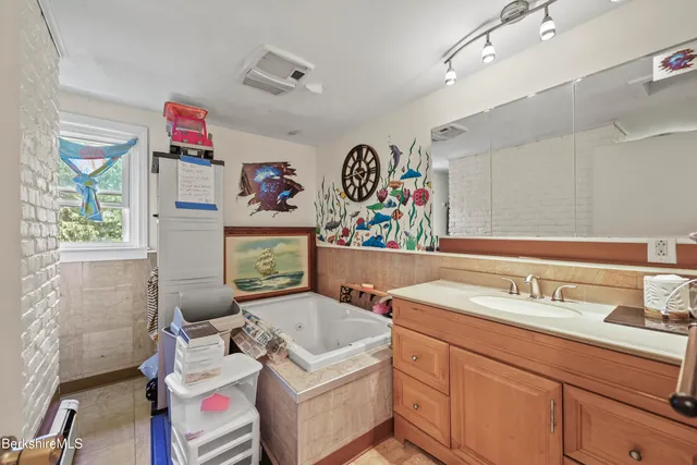 a utility room with sink dryer and washer