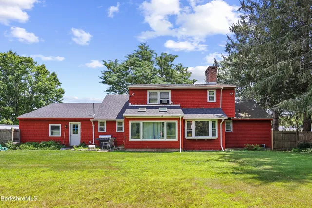 a view of a yard in front of a house with a yard