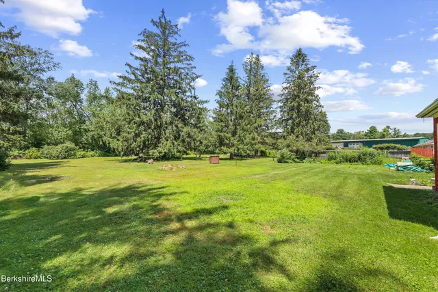 a view of outdoor space with deck and yard
