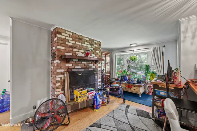 a living room filled with furniture and a window