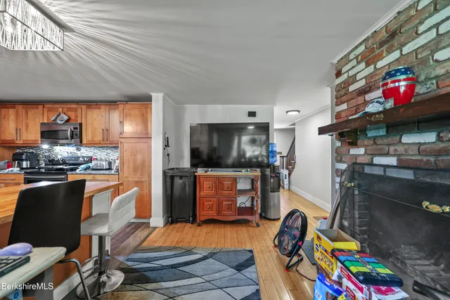 a bedroom with furniture and a flat screen tv