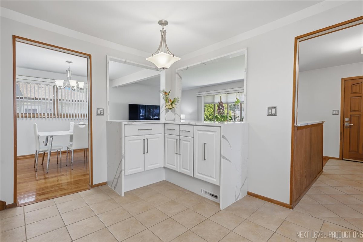 754 North Michigan Street Elmhurst, IL 60126 - Photo 13 of 32 a kitchen with white cabinets and sink